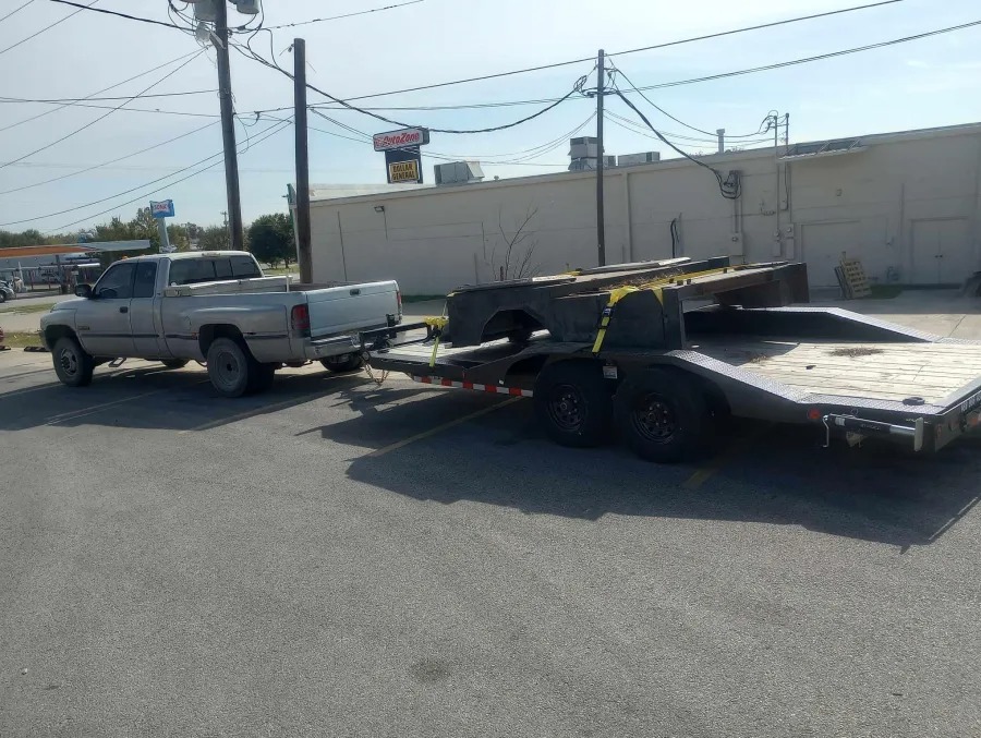 IronBull car hauler trailer being towed by a pickup truck